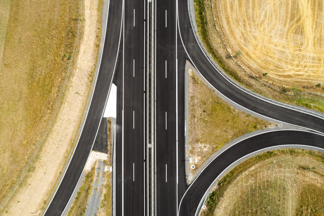 Aerial view of highway intersection and fields.